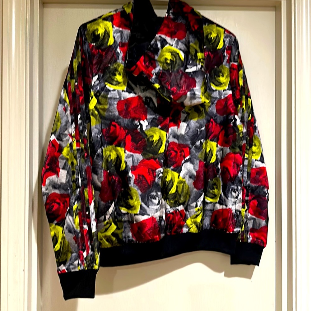Rose-printed adidas zip-up jacket.